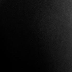 A close-up of a material swatch in Black RAL 9005. The surface is smooth with a subtle texture and a low-gloss finish.
