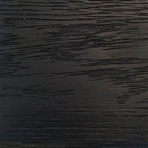 Material swatch of black stained solid ash wood with a lacquered finish, showing a detailed close-up of the horizontal grain.
