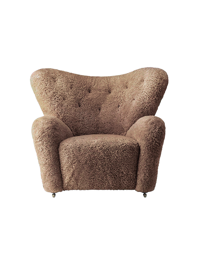 Front view of The Tired Man Lounge Chair in Sahara sheepskin, with a high back, button tufting and plush arms.