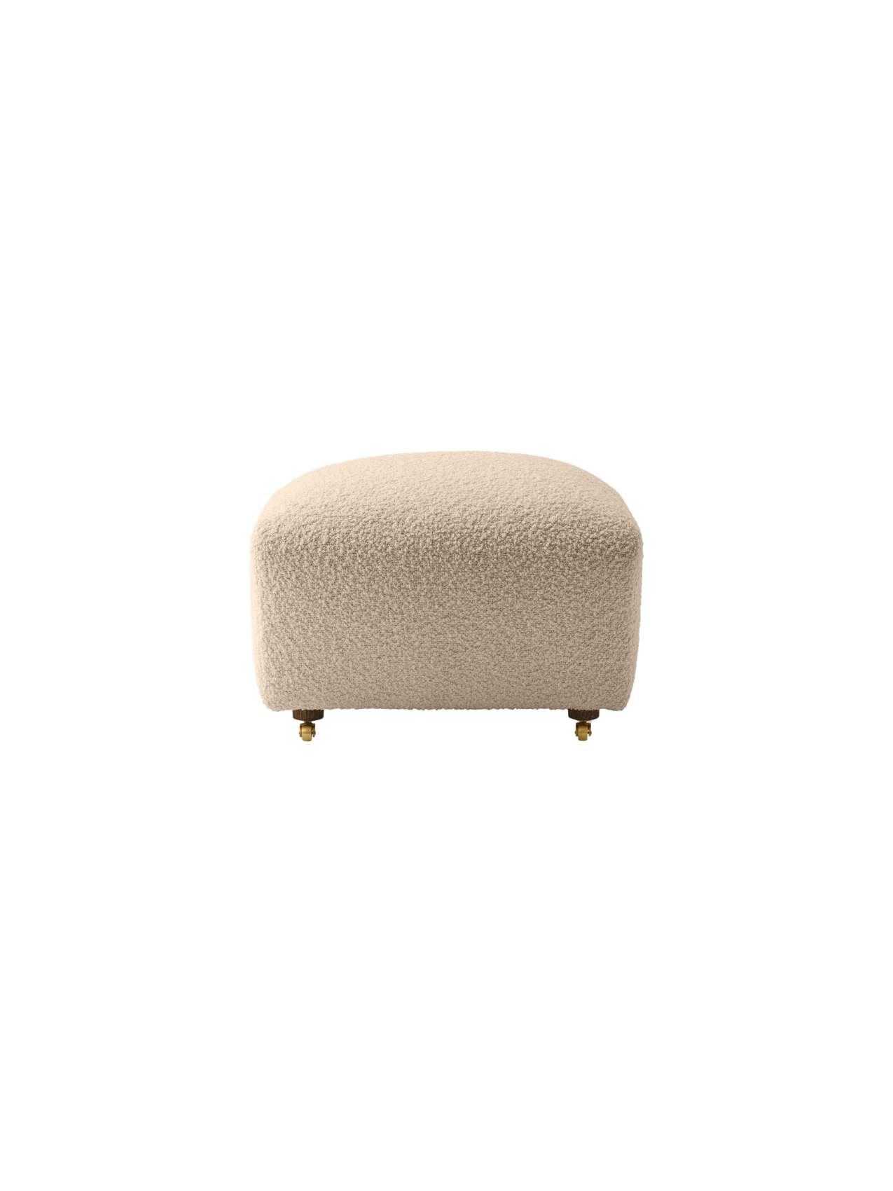 A front view of The Tired Man Ottoman, featuring its plush, off-white textured upholstery and short legs with brass casters.