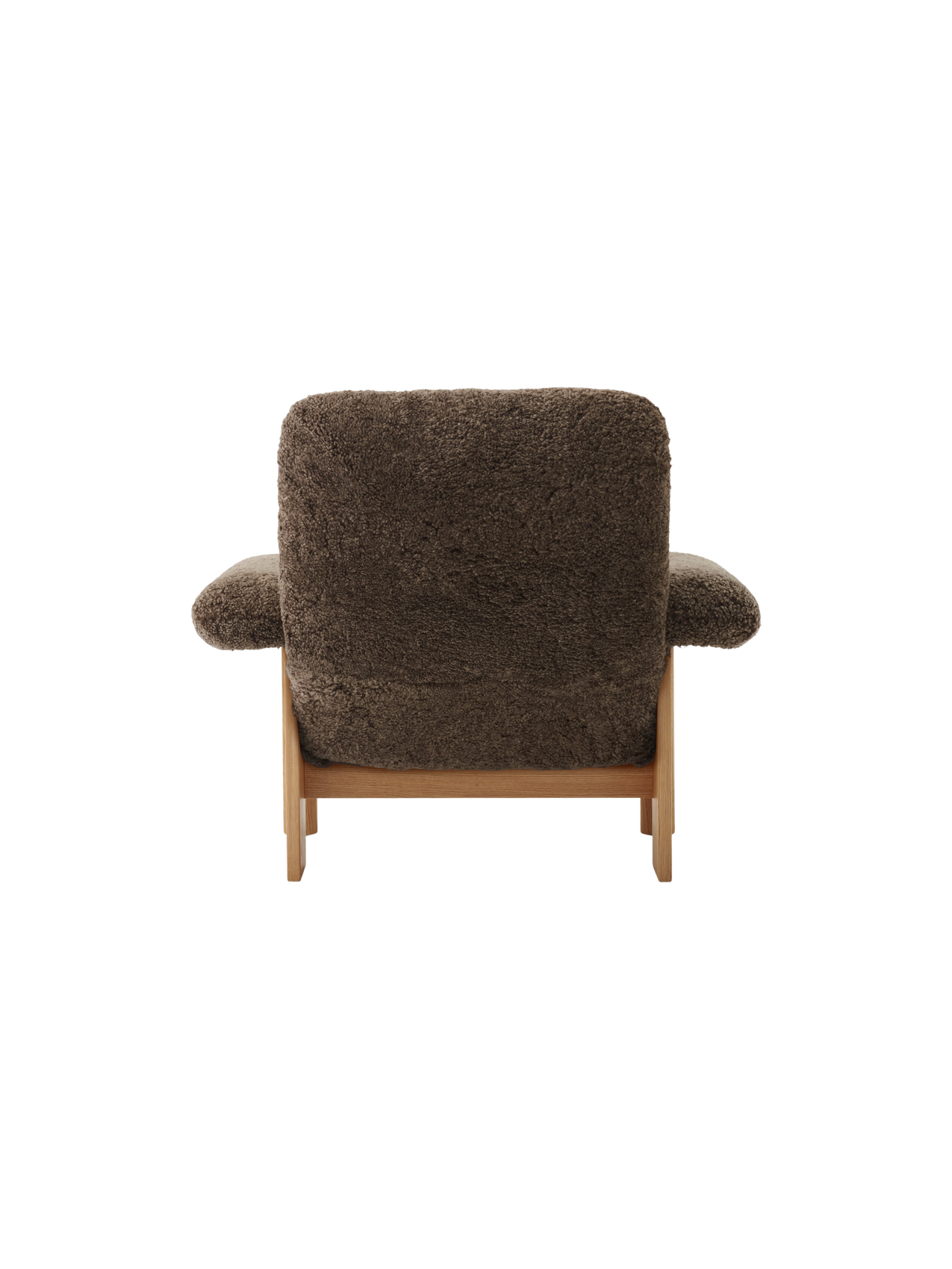 Back view of the Brasilia Lounge Chair, High Back, upholstered in dark brown Sheepskin Root with a natural oak frame.