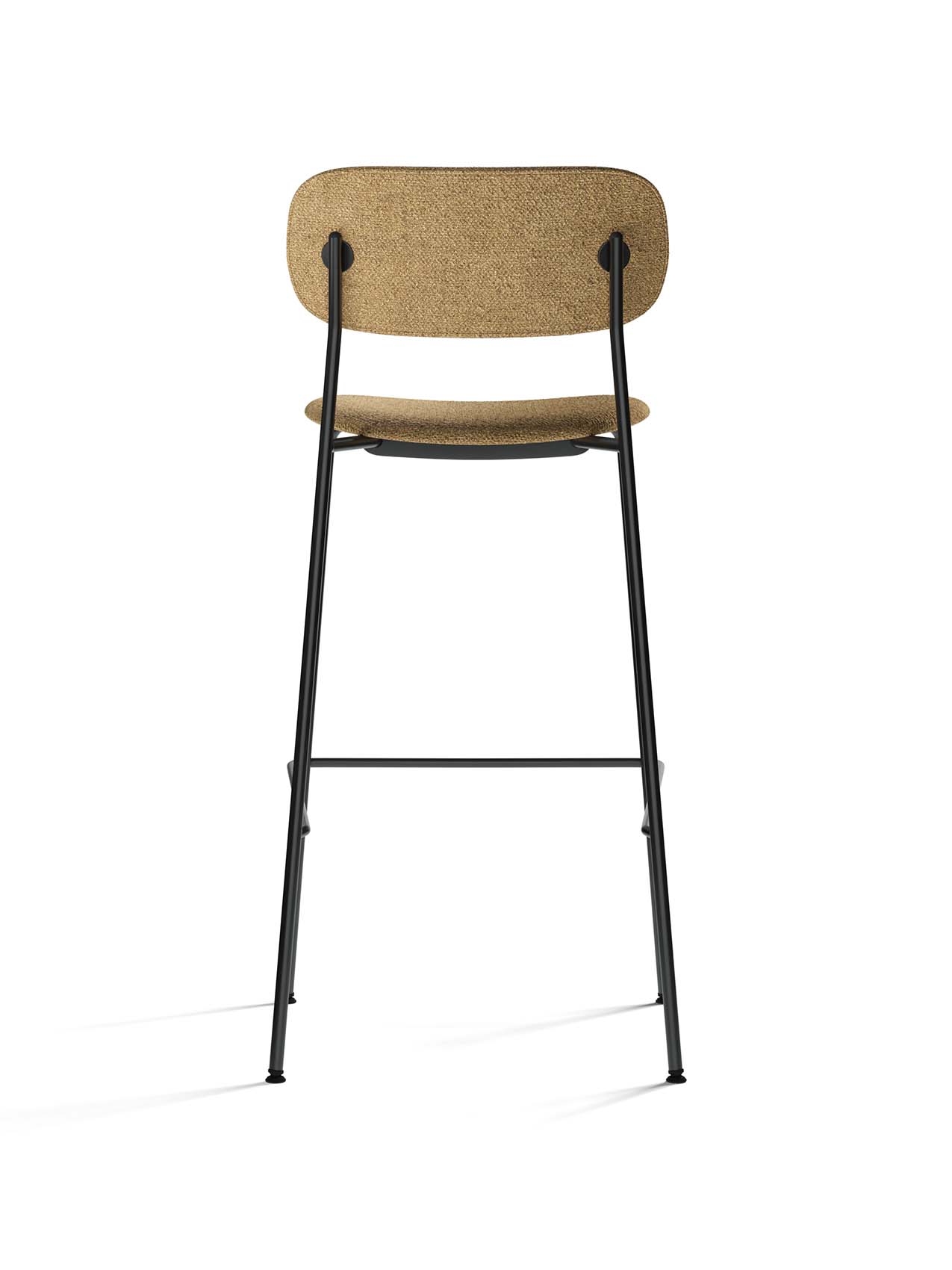 Rear view of the Co Bar Chair in light brown bouclé fabric. The chair has a slender, tubular black steel frame and footrest.