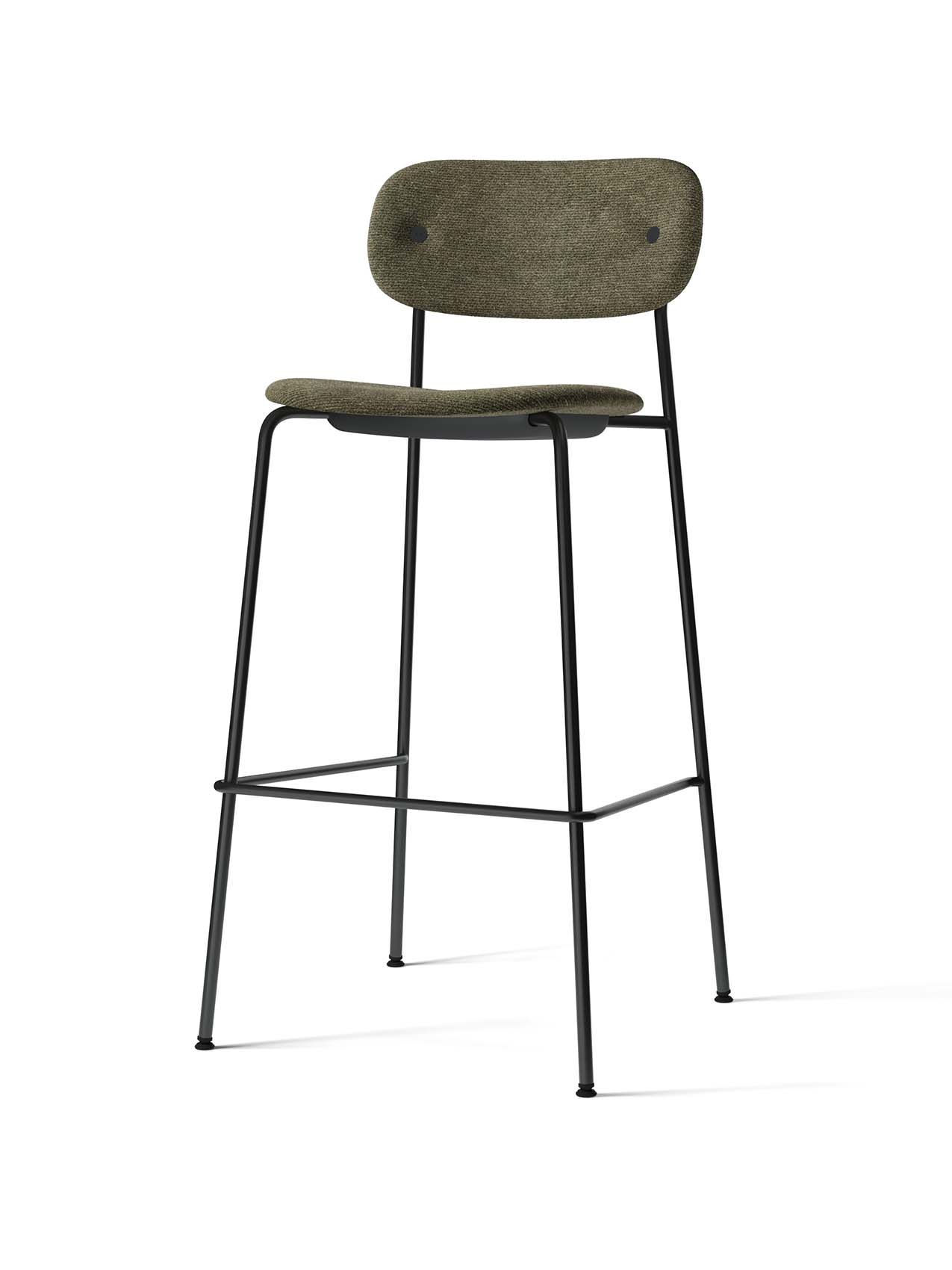 An angled view of the Co Bar Chair, Fully Upholstered, with moss green fabric seat and backrest on a black steel frame.