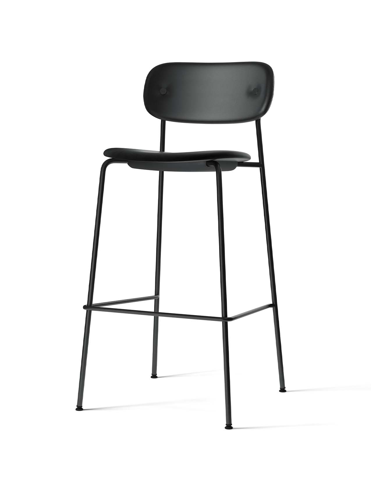 A fully upholstered Co Bar Chair in black with a slender black steel frame, viewed from an angle against a white background.