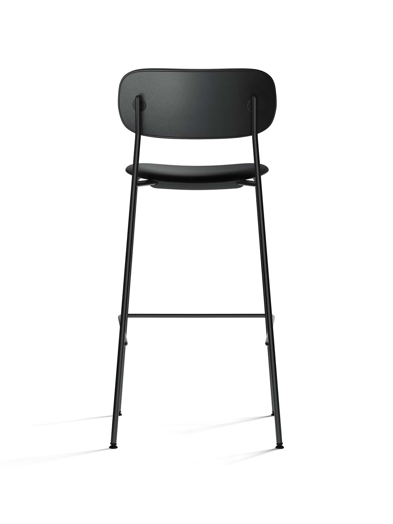 Rear view of the Co Bar Chair, fully upholstered in black Dakar leather with a slender, black powder-coated steel frame.
