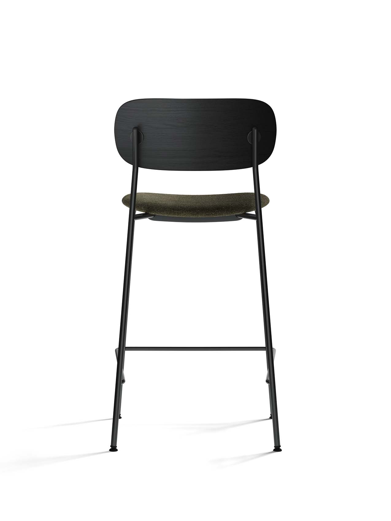 Rear view of the Co Counter Chair with a black oak backrest, moss-coloured upholstered seat, and a slender black steel frame.