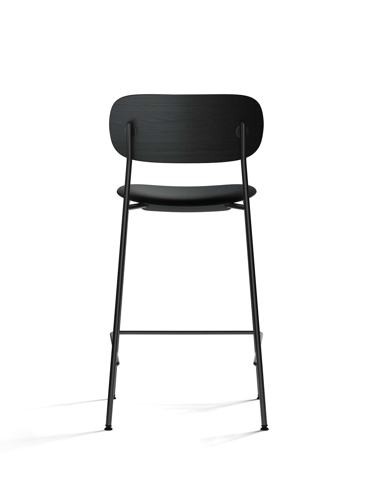 Back view of the Co Counter Chair with an upholstered seat, showing the black oak backrest and slender black steel frame.