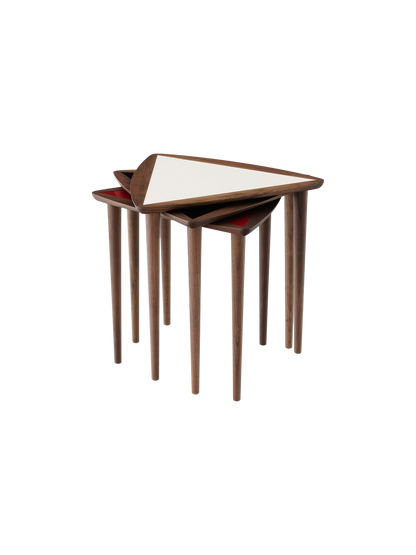Umanoff Nesting Side Table in Walnut and Fog, a set of three tables stacked together on a black background.