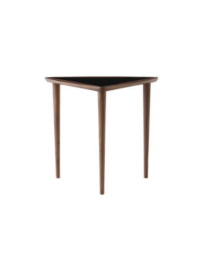 A single Umanoff Nesting Side Table with a triangular black top and a walnut frame with three slender, tapered legs.