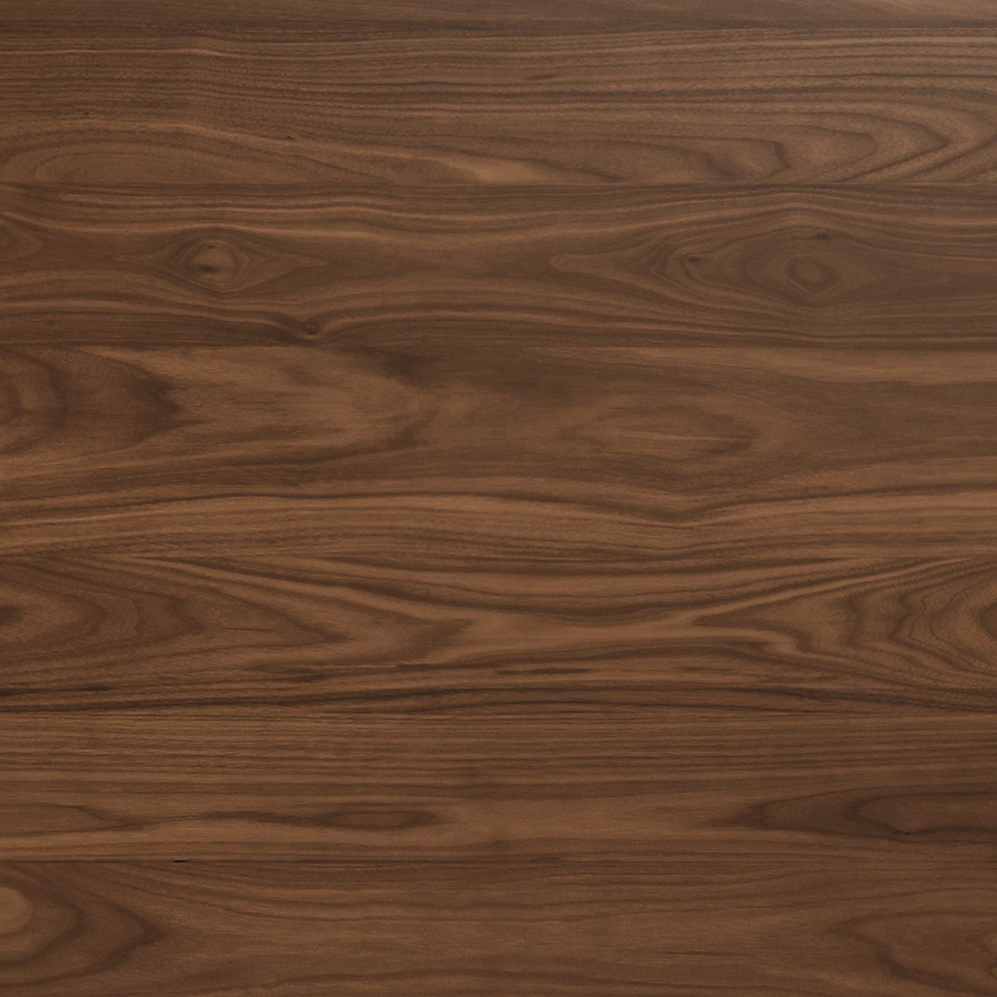 A close-up, detailed shot of a walnut wood surface, showcasing its rich brown tones and distinctive horizontal grain pattern.