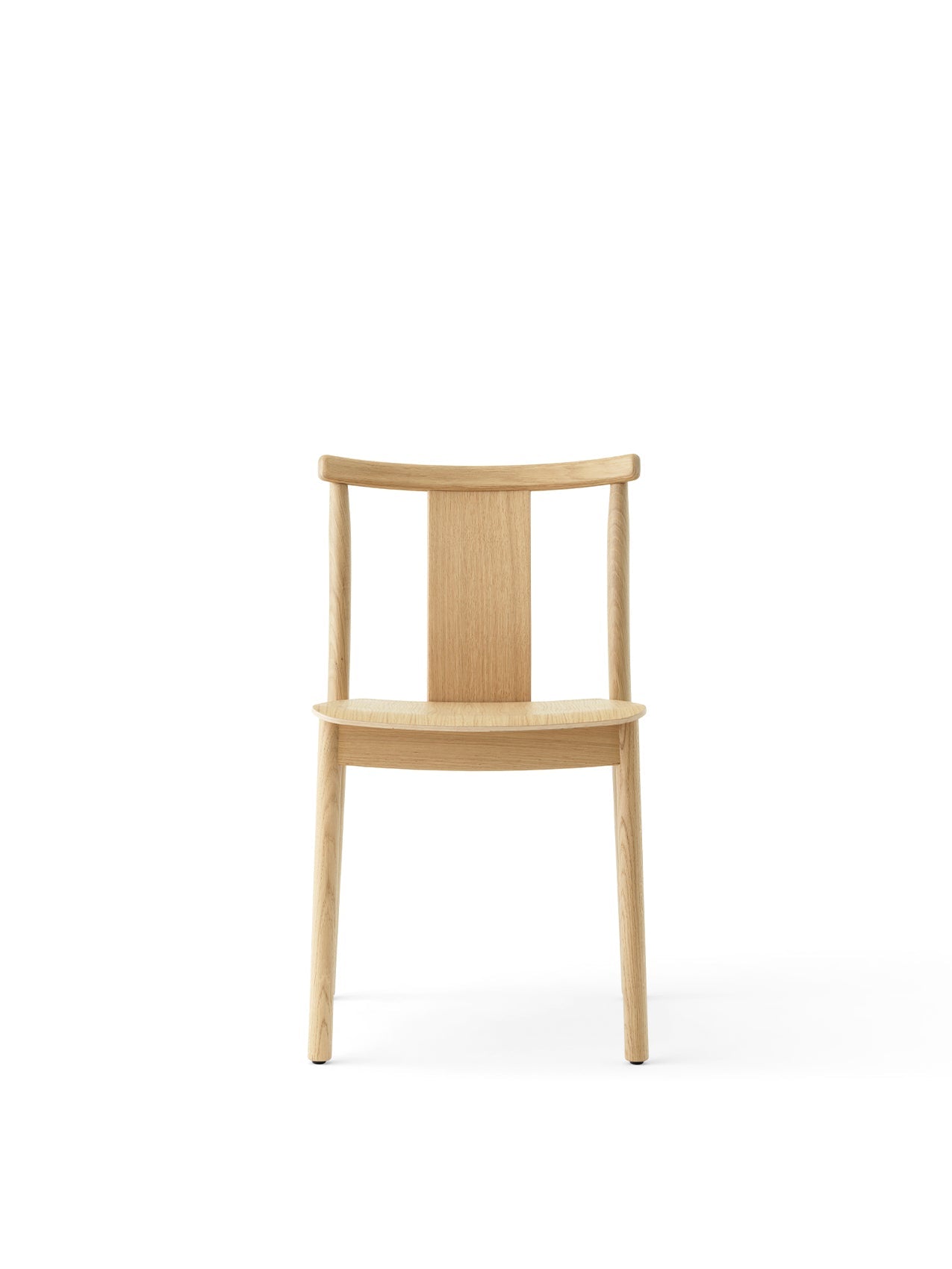 Front view of the Merkur Dining Chair in natural oak, showing its minimalist design with a curved backrest and four legs.