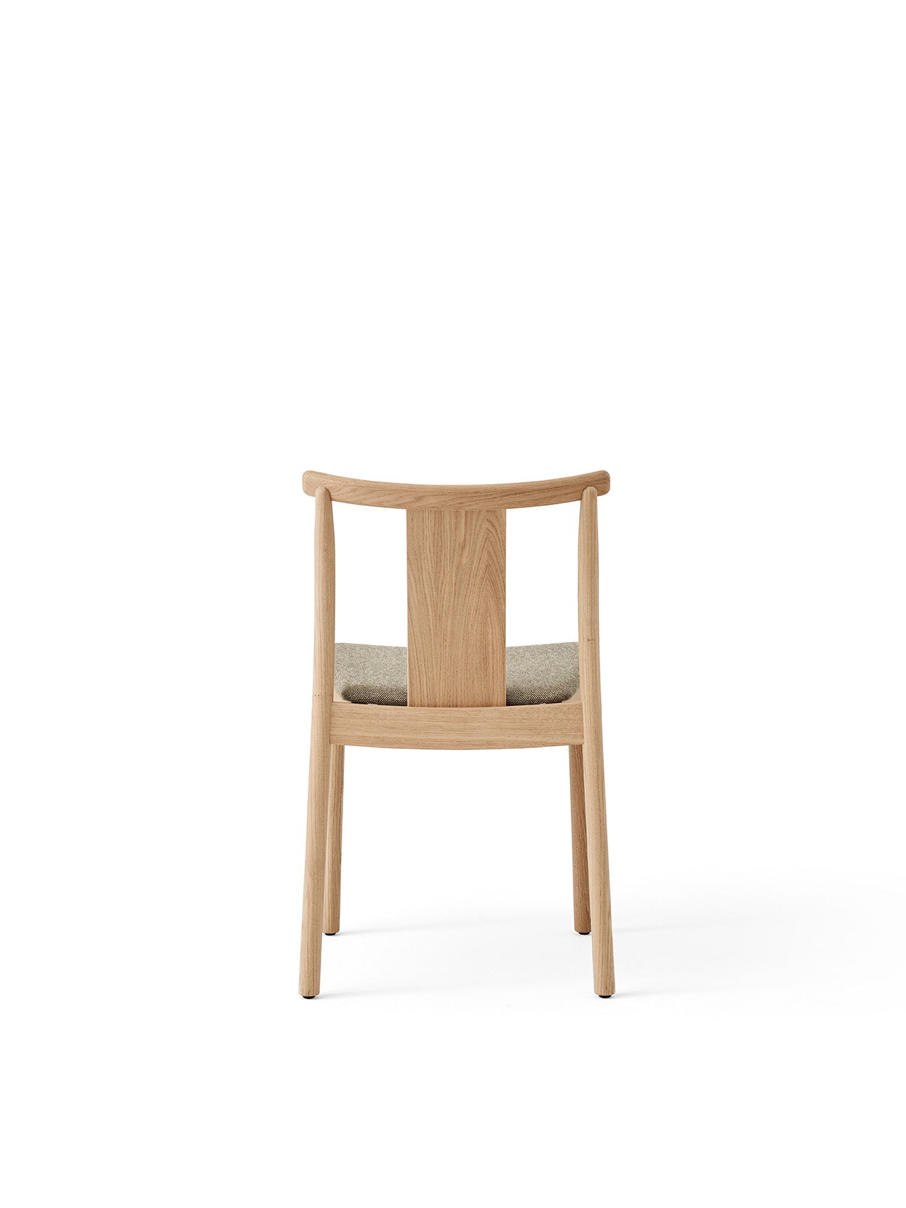 Back view of the Merkur Dining Chair in natural oak, featuring a curved backrest and a light grey upholstered seat.