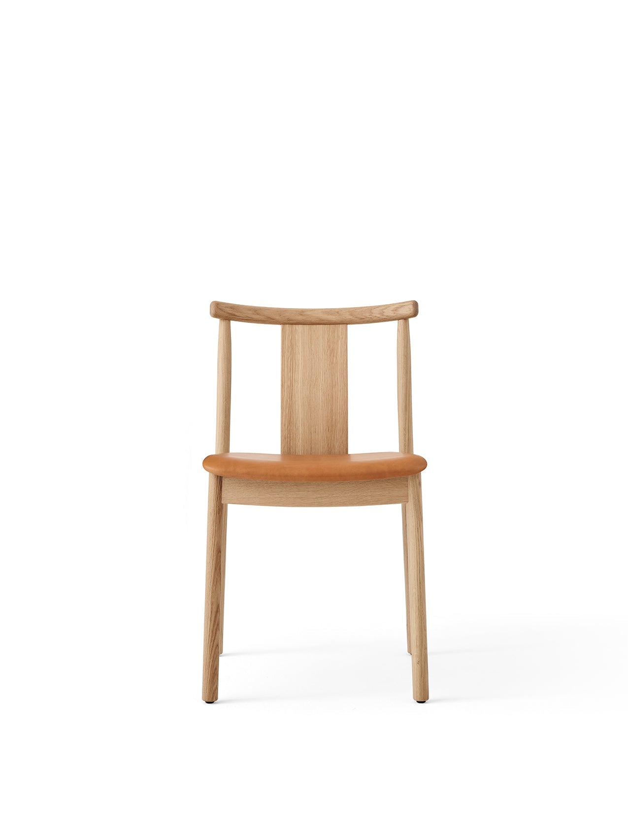 Front view of the Merkur Dining Chair, shown with a natural oak frame and an upholstered seat in warm tan Dakar leather.