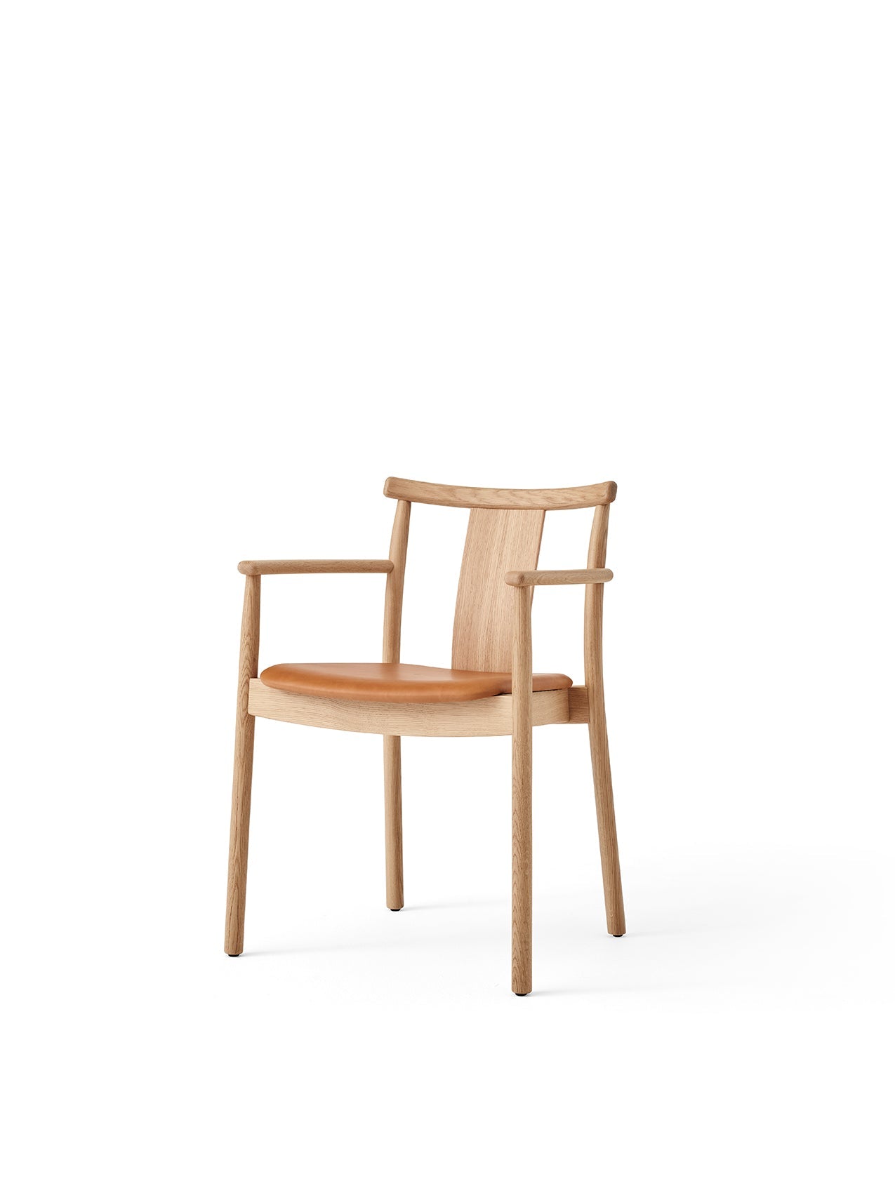 A Merkur Dining Chair with Armrests, in natural oak with a tan Dakar leather seat, shown at an angle on a white background.