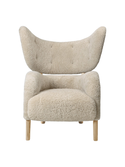 Front view of the My Own Chair with off-white Moonlight sheepskin upholstery, a winged back, and natural oak legs.