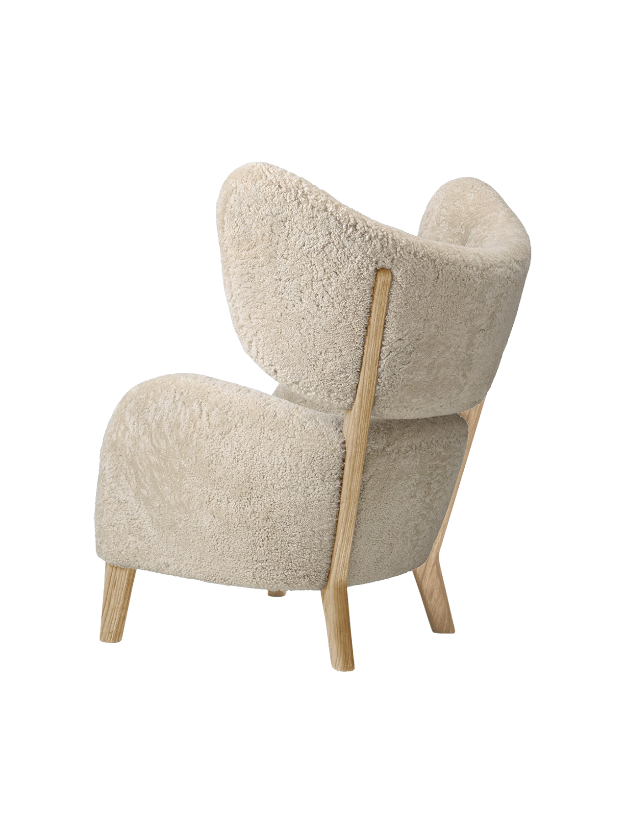 A three-quarter rear view of the My Own Chair, featuring plush Moonlight Sheepskin upholstery and a solid oak frame.