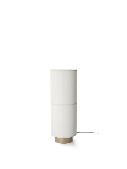 Front view of the white Hashira Floor Lamp: a cylindrical linen shade with visible frame, on a circular, ash wood base.