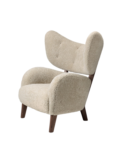 A three-quarter view of the My Own Chair, featuring plush Sheepskin Moonlight upholstery and a contrasting dark wood frame.