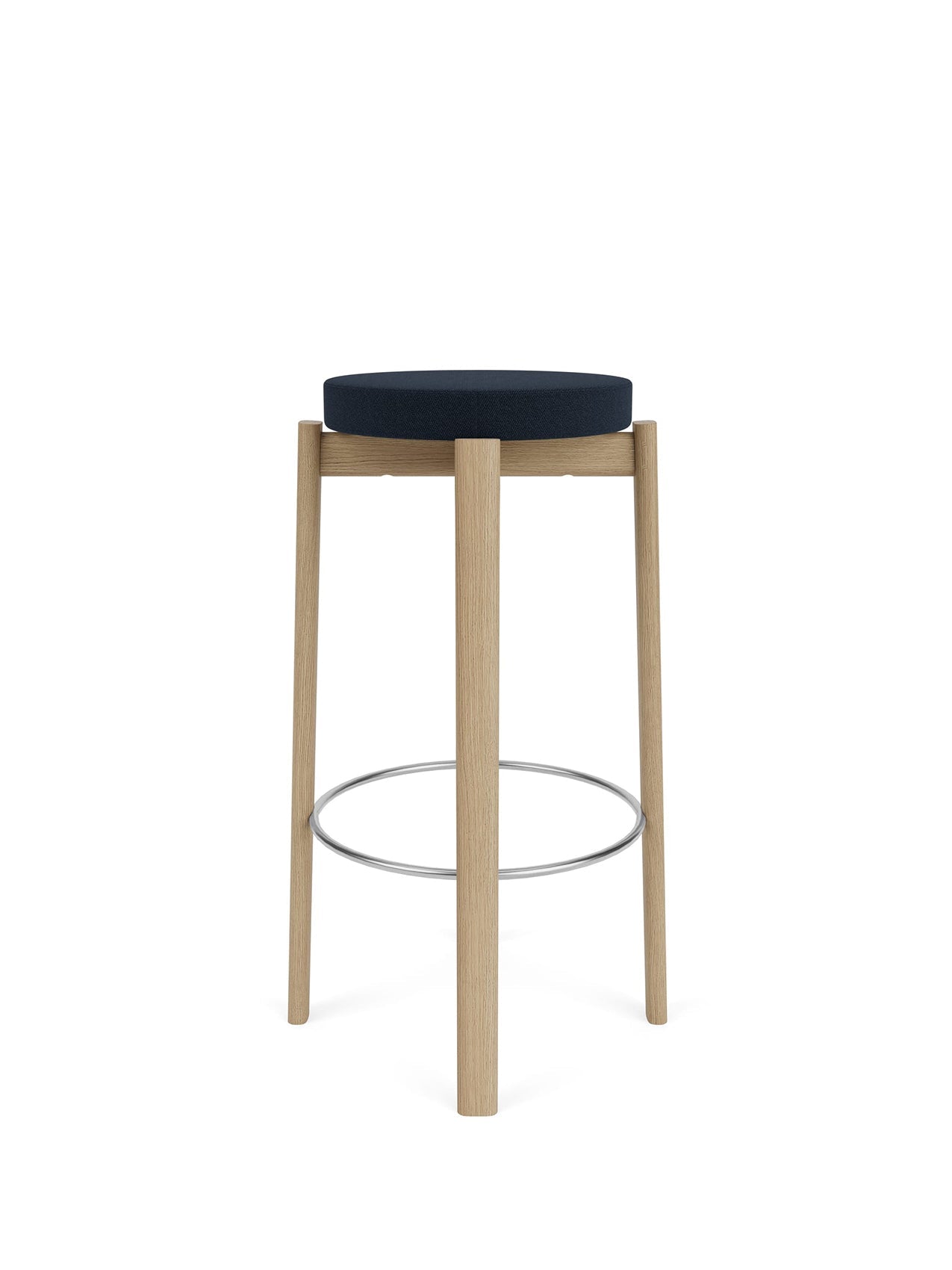 Front view of the Passage Bar Stool with a dark blue upholstered seat, a natural oak frame, and a circular steel footrest.