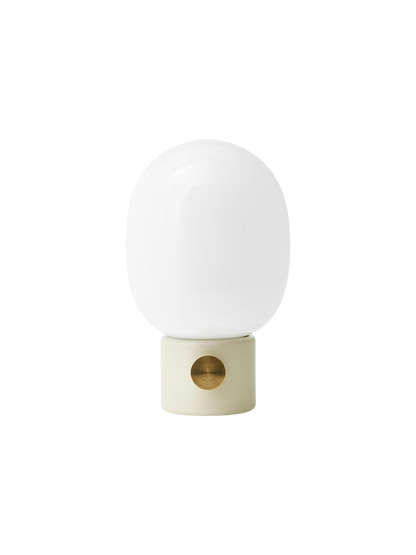 Front view of the JWDA Table Lamp with an alabaster white steel base, a round brass dimmer, and a white opal glass shade.