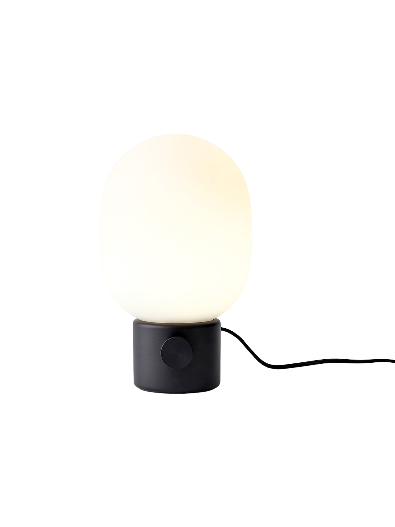 A front view of the JWDA Table Lamp, Small, in black painted steel with its illuminated white opal glass shade.
