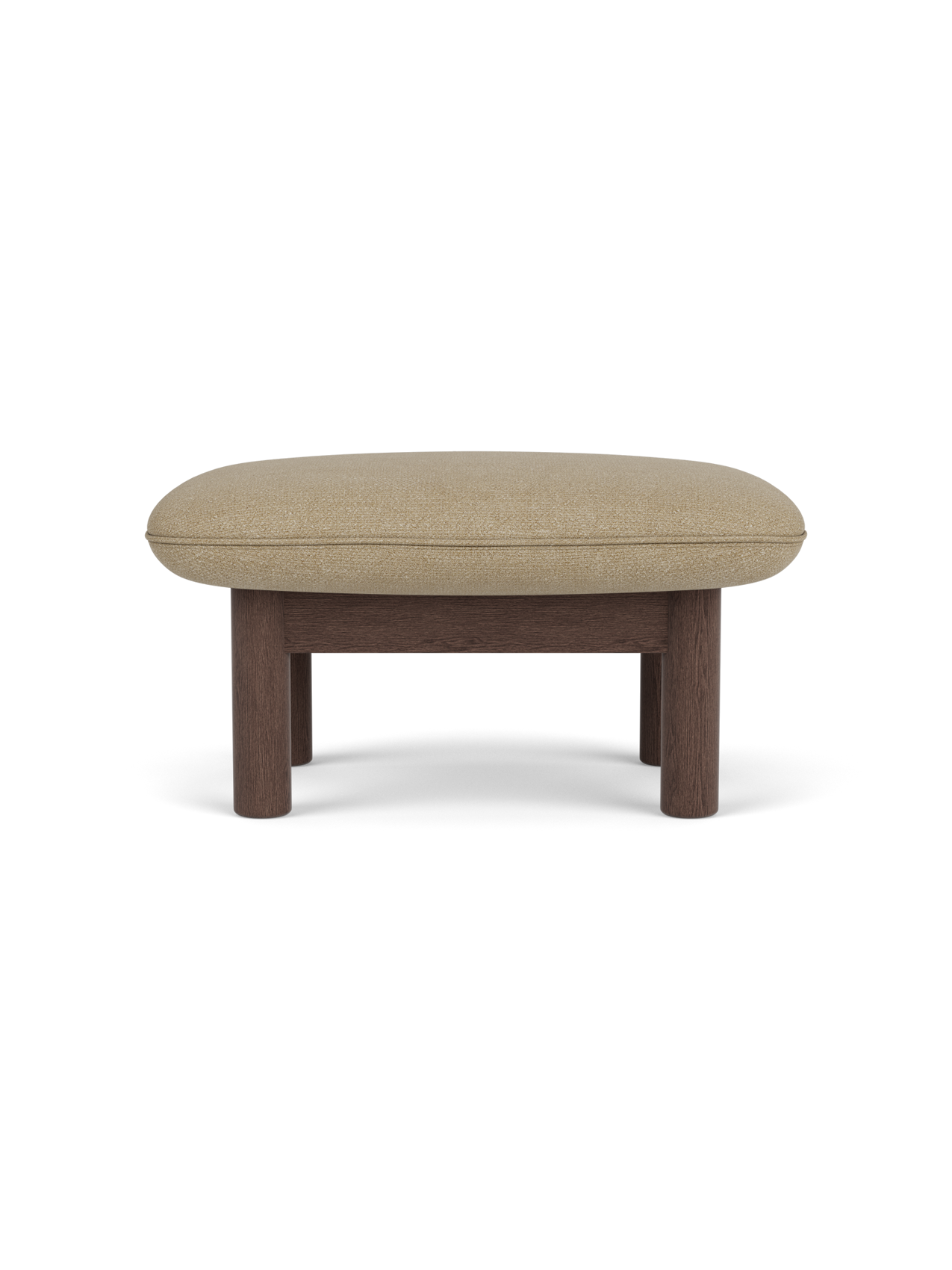 Side view of the Brasilia Ottoman with a dark stained oak frame, robust cylindrical legs and soft Audo Bouclé 02 top.
