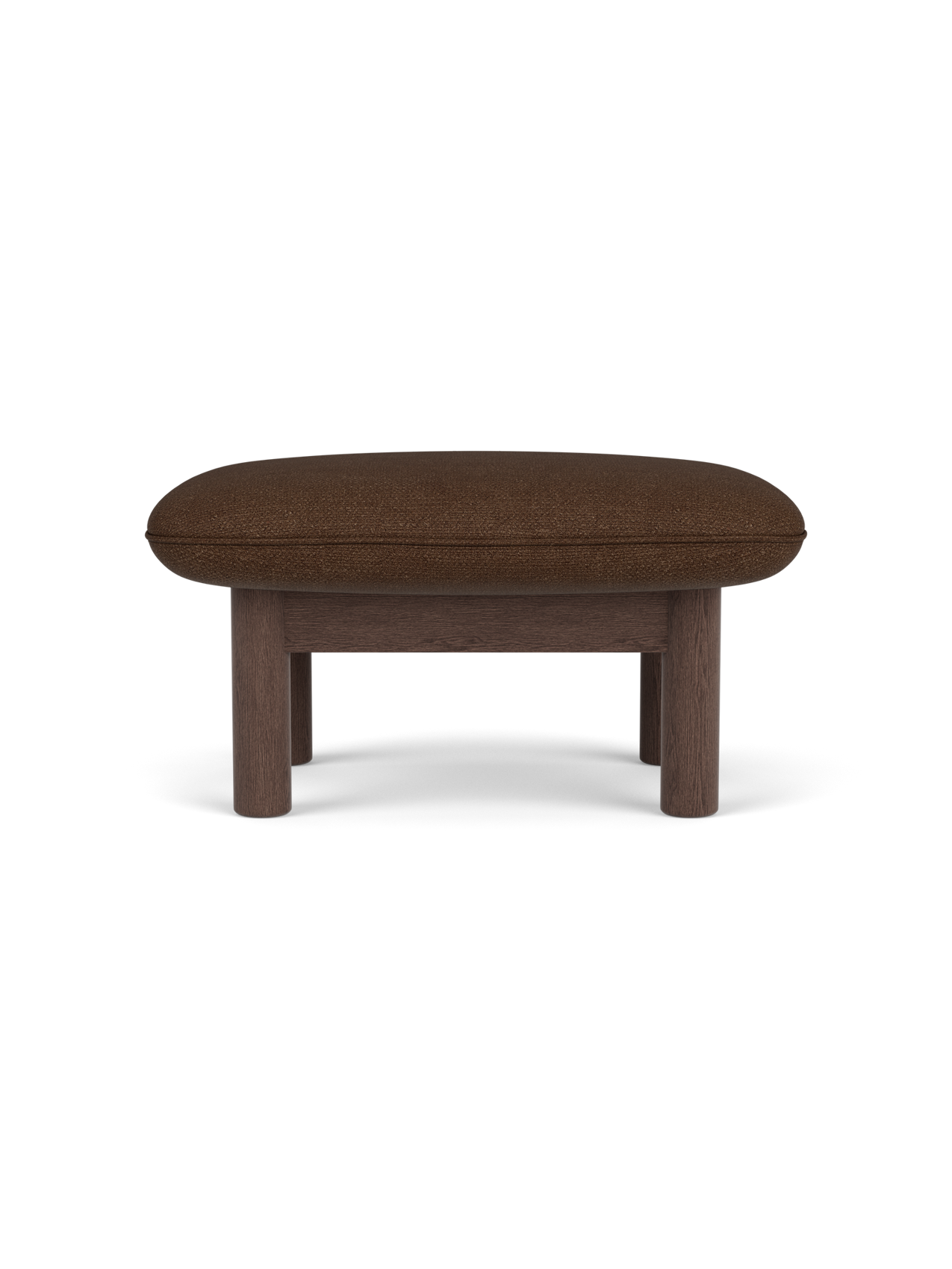 Side view of the Brasilia Ottoman, upholstered in brown Audo Bouclé 07 fabric, with four sturdy dark stained oak legs.