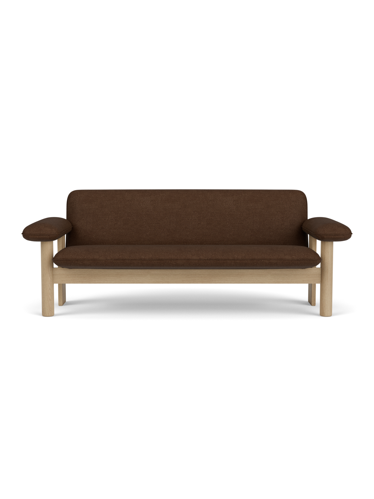 A front-on view of the Brasilia Sofa with a natural oak frame, exaggerated armrests and brown Audo Bouclé 07 upholstery.