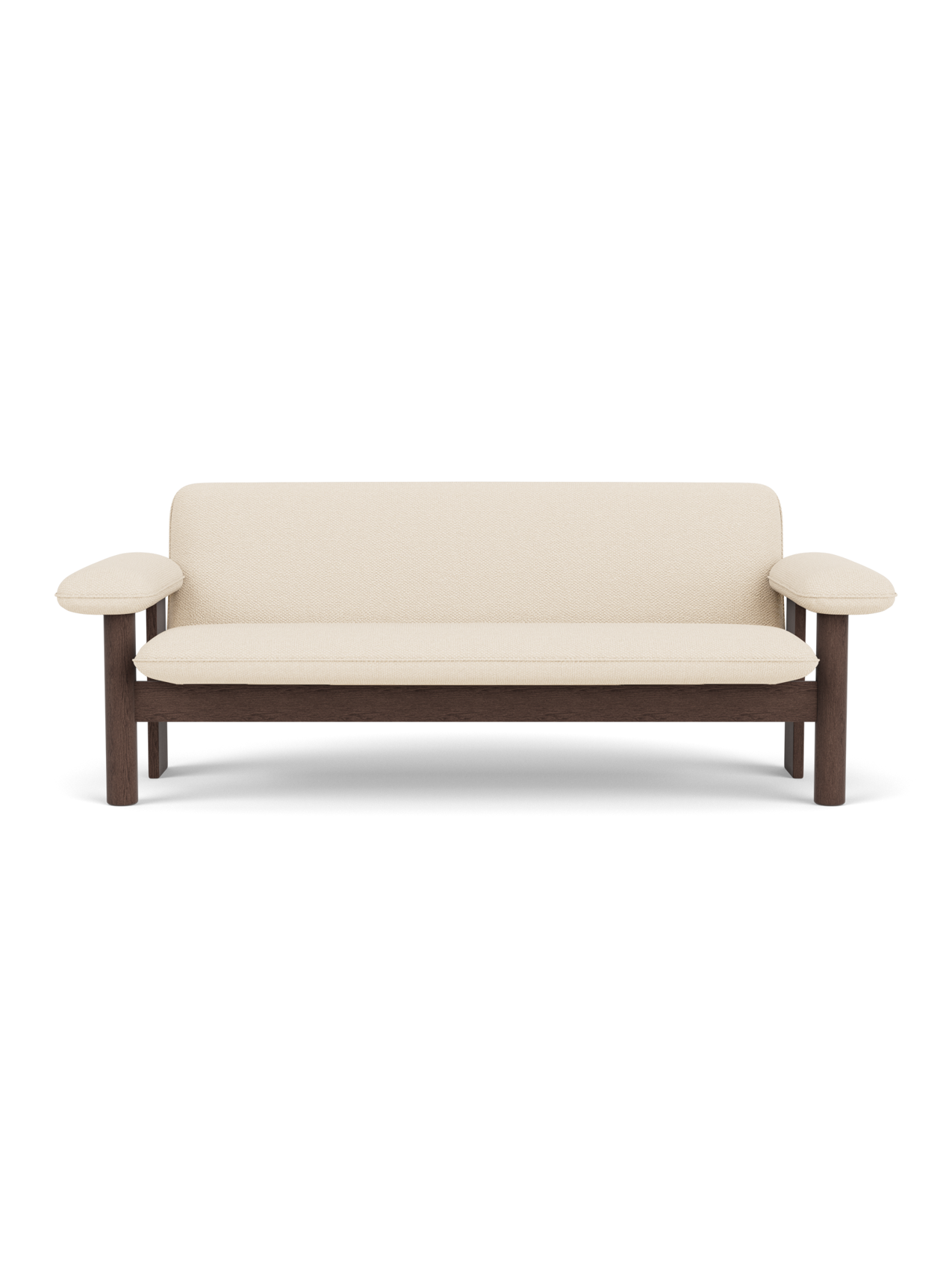 Front view of the Brasilia Sofa, featuring a dark stained oak frame and upholstered in light-coloured Logan Jasmine textile.