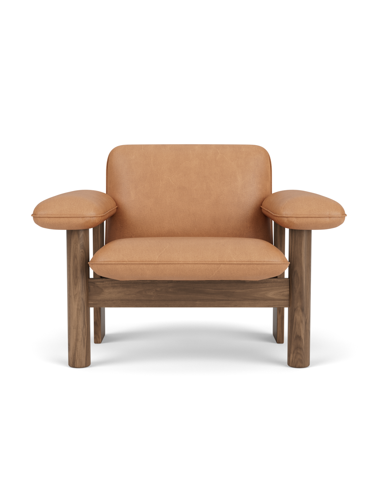 A front-on studio shot of the Brasilia Lounge Chair, Low Back. The chair has a solid walnut frame and camel upholstery.