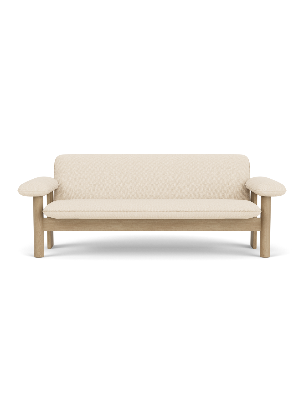 A front-on view of the Brasilia Sofa, featuring a natural oak frame with rounded armrests and plush Logan Jasmine upholstery.