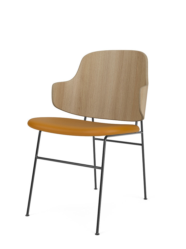 The Penguin Dining Chair with a natural oak backrest, mustard Dakar leather seat and a slim black metal frame.