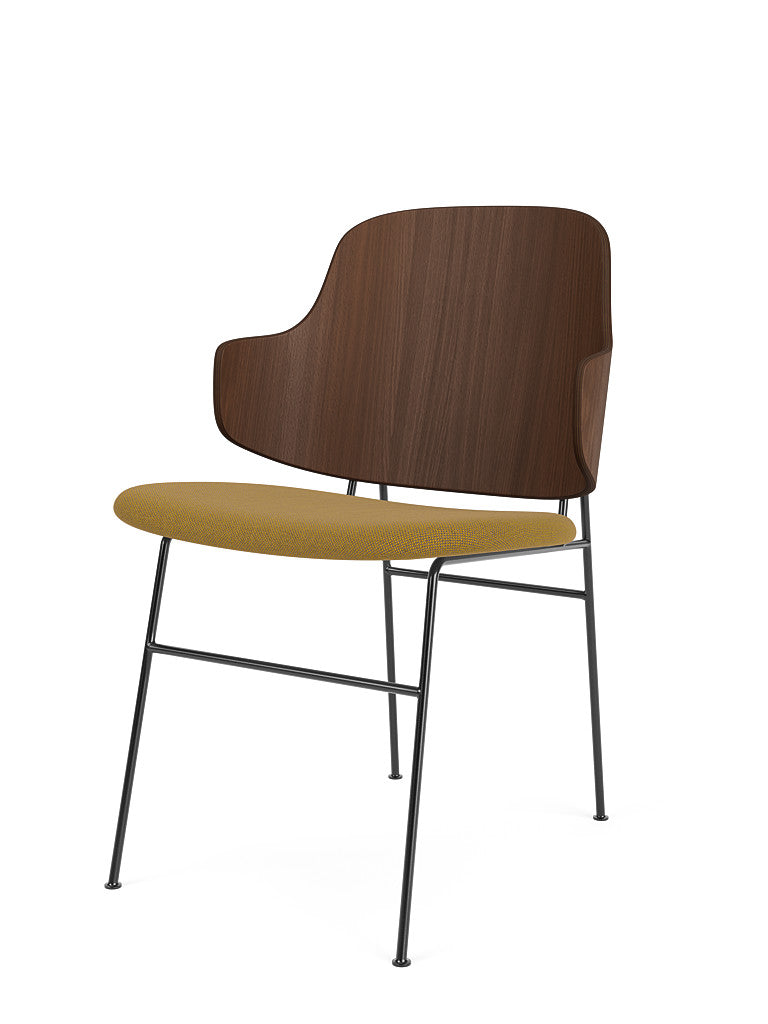 Angled view of The Penguin Dining Chair, with a walnut veneer backrest, a yellow Re-Wool seat, and a black metal frame.