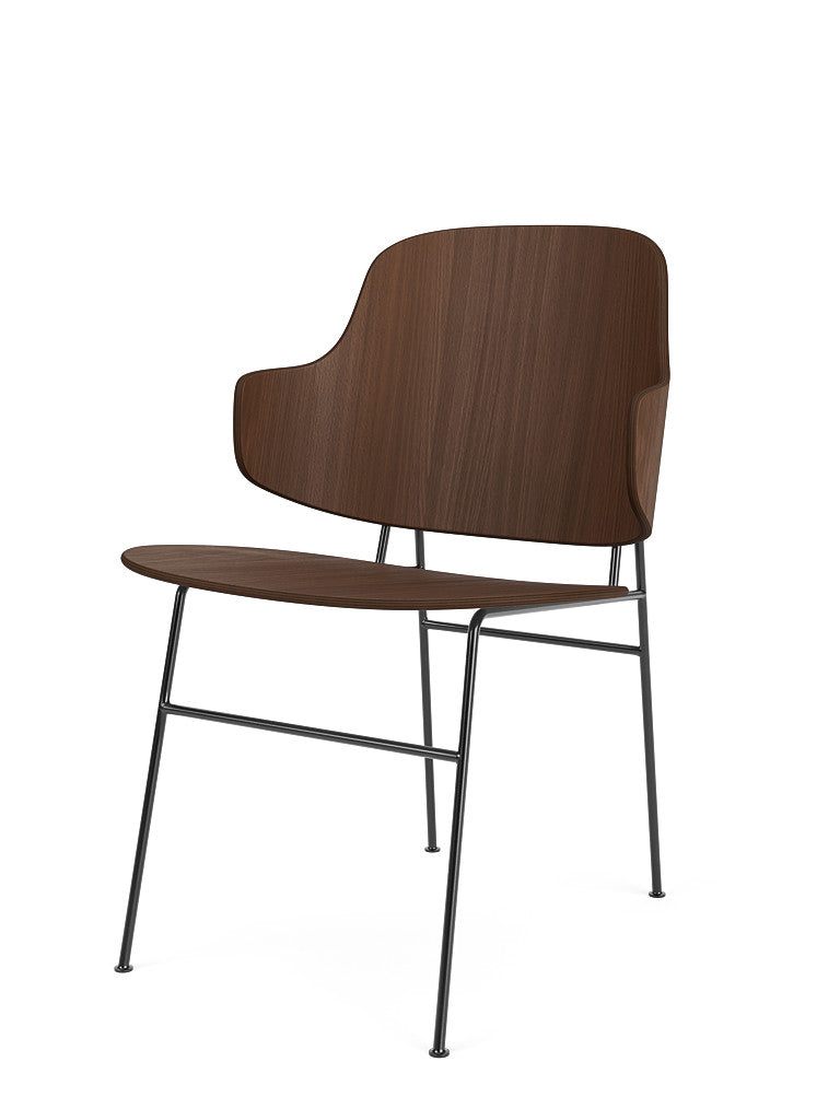 The Penguin Dining Chair in walnut veneer with a black powder-coated steel frame, shown on a white background from an angle.