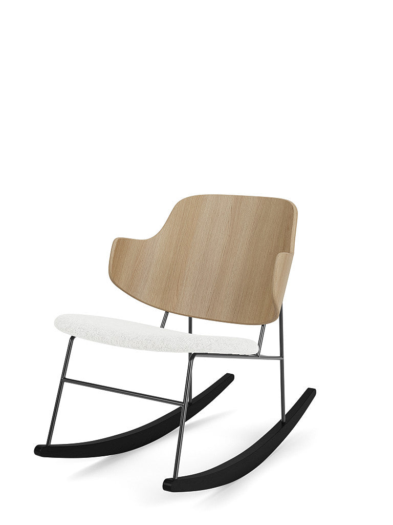 Angled view of The Penguin Rocking Chair with a Natural Oak back, a white Hallingdal seat, and a black steel frame.