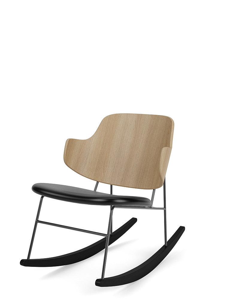 The Penguin Rocking Chair with a natural oak backrest, a black upholstered seat, and a slender black metal frame and rockers.
