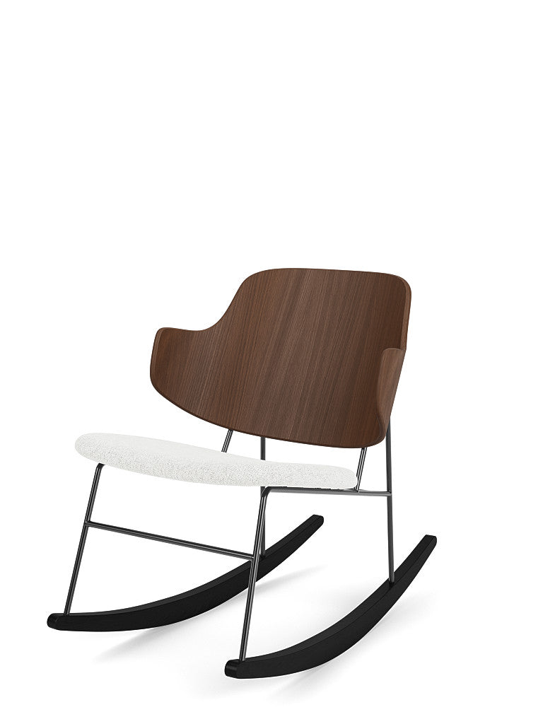 Angled view of The Penguin Rocking Chair with a walnut backrest, a textured white upholstered seat, and a black metal frame.