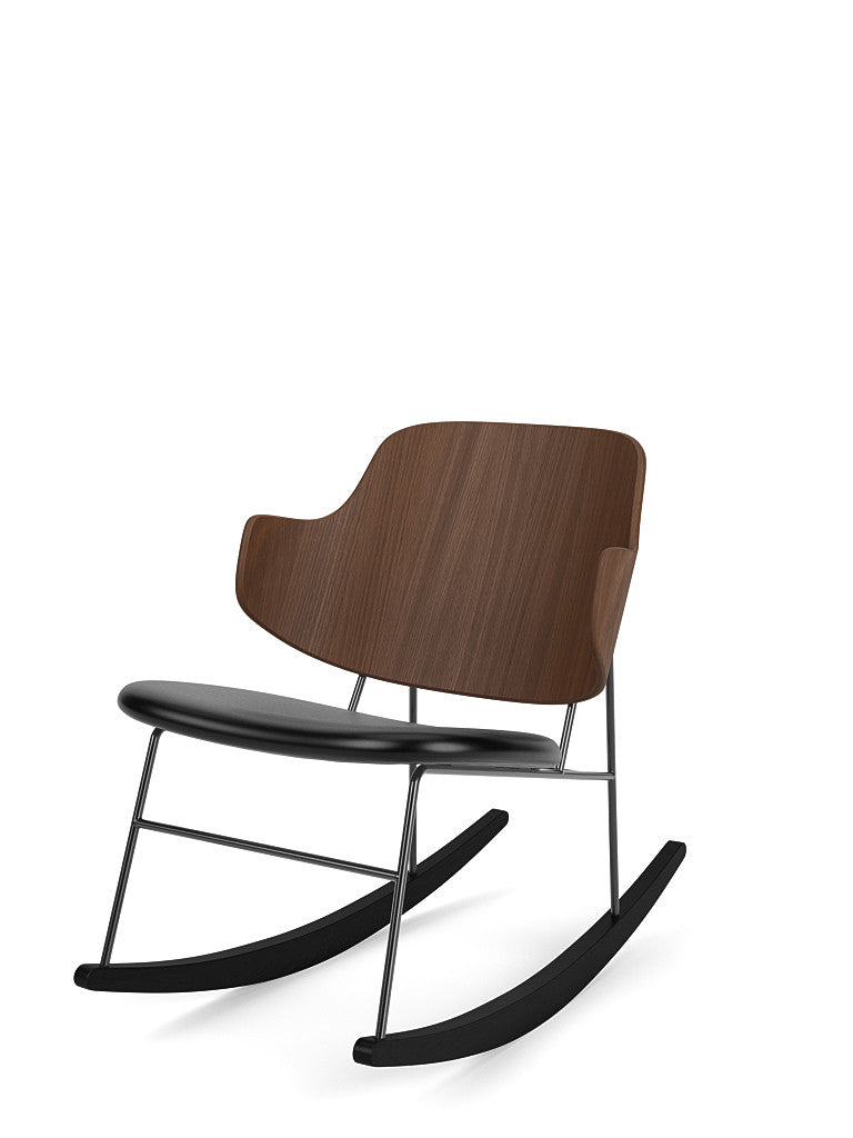 The Penguin Rocking Chair with a dark walnut veneer backrest, a black leather seat, and a black steel frame.