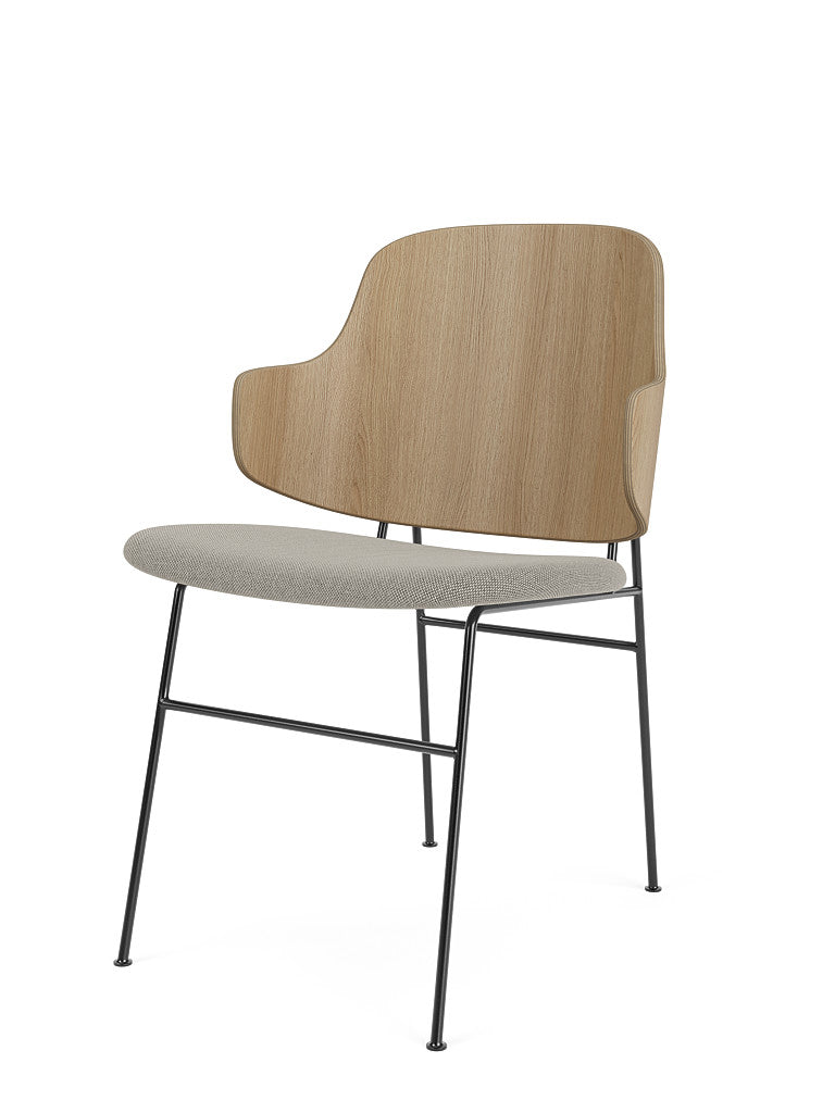 The Penguin Dining Chair, viewed at an angle, with a natural oak backrest, a light grey Re-Wool 218 seat and a black frame.