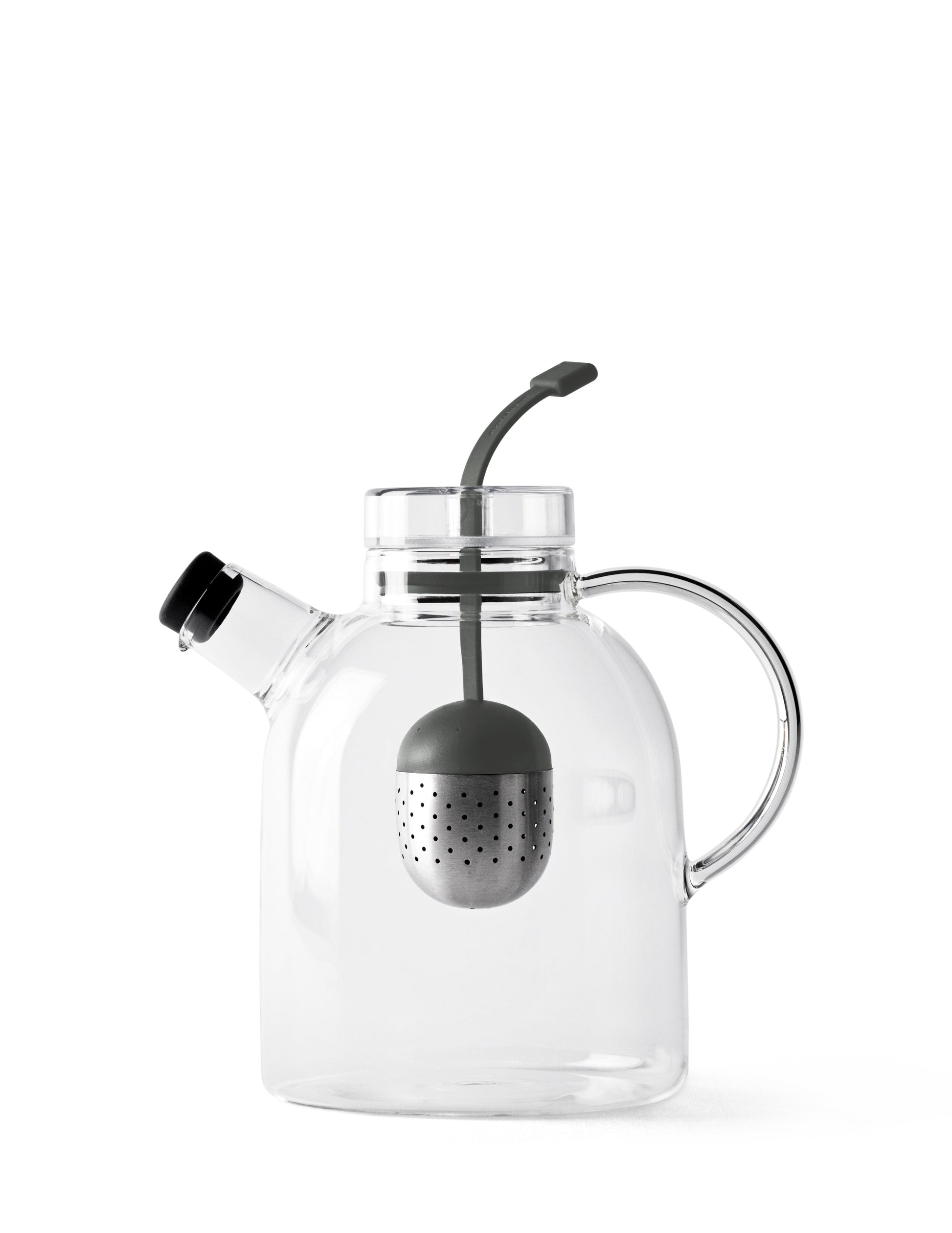 The Audo Kettle Teapot, a minimalist glass teapot with a steel and silicone tea infuser inside, against a white background.