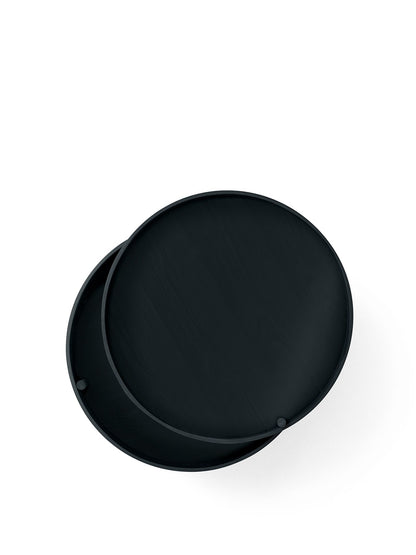 Top-down view of the black ash Turning Table, its circular lid partially rotated to show the storage space beneath.