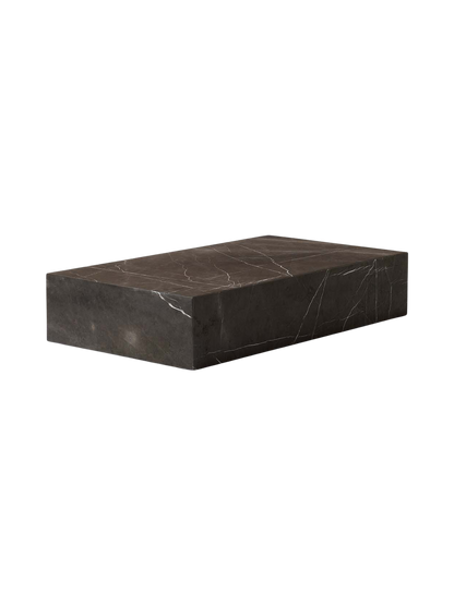 Angled view of the Plinth Grand, a low rectangular plinth of dark Grey Kendzo marble with distinctive white veining.