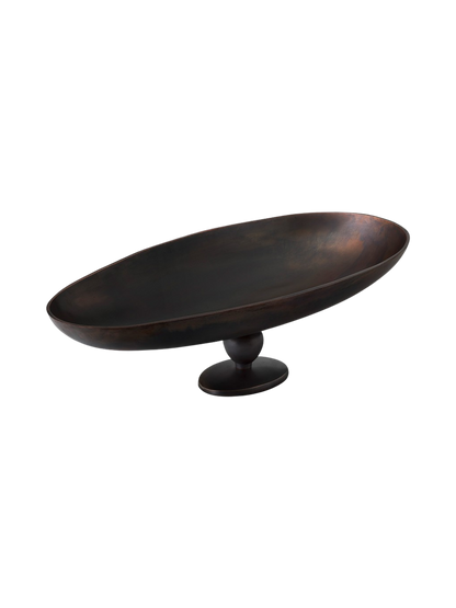Angled view of a wide, oval decorative bowl on a pedestal. The bowl features a dark, patinated bronze finish.