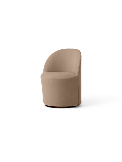 Angled view of the Tearoom Club Chair on a swivel base, fitted with the textured, light brown Logan Flint loose cover.
