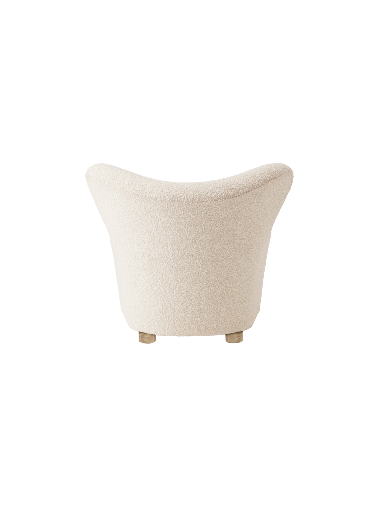 Back view of The Tired Man Lounge Chair in a textured, off-white fabric, showing its curved back and short wooden legs.