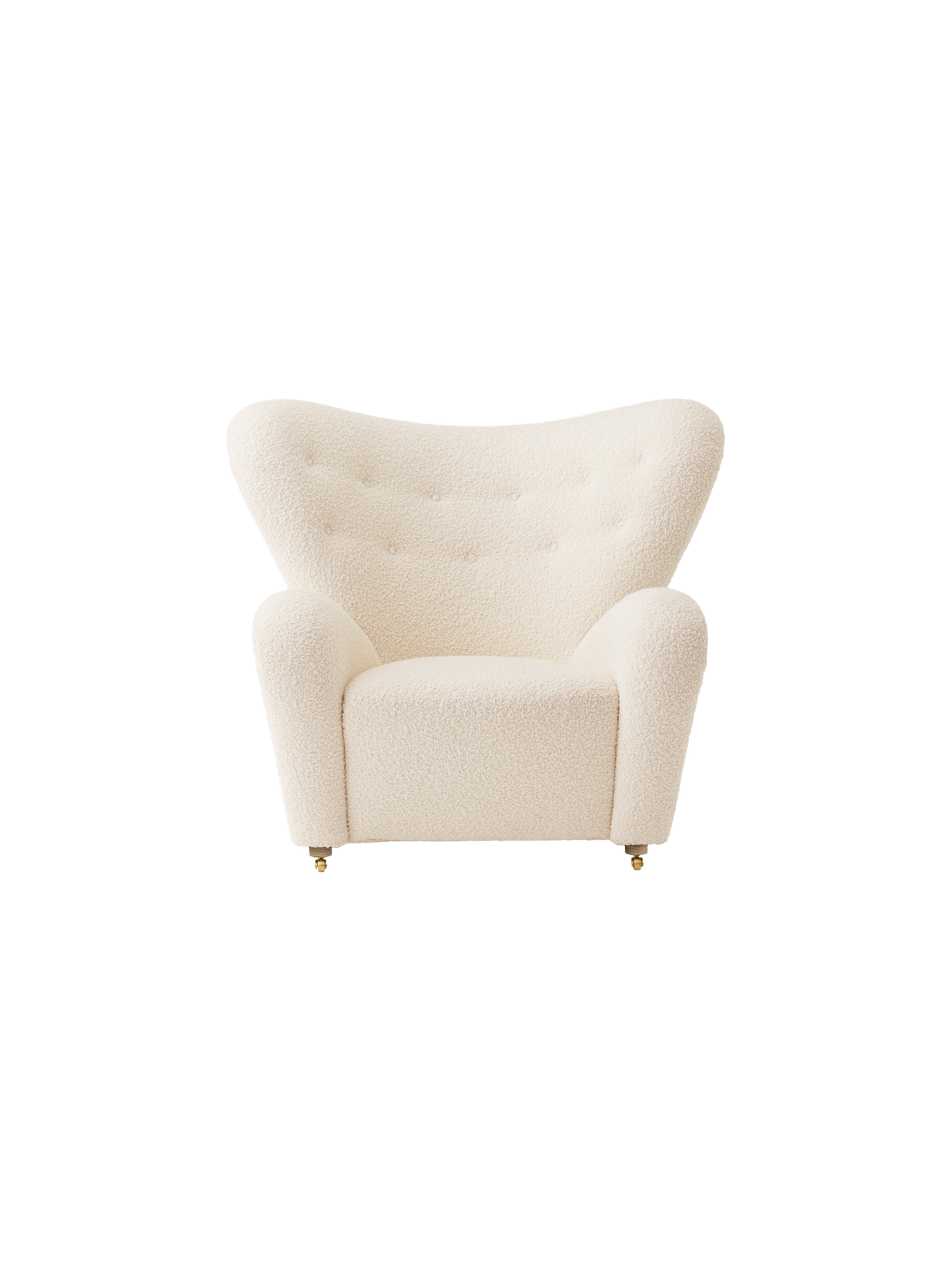 Front view of The Tired Man Lounge Chair in cream textile with a high, curved back, rounded arms and brass castors.