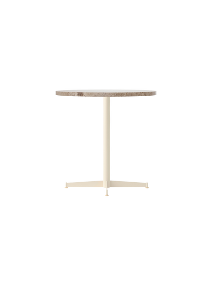 Side view of the Nook Dining Table with a round Kunis Breccia stone top and an ivory powder-coated steel four-star base.