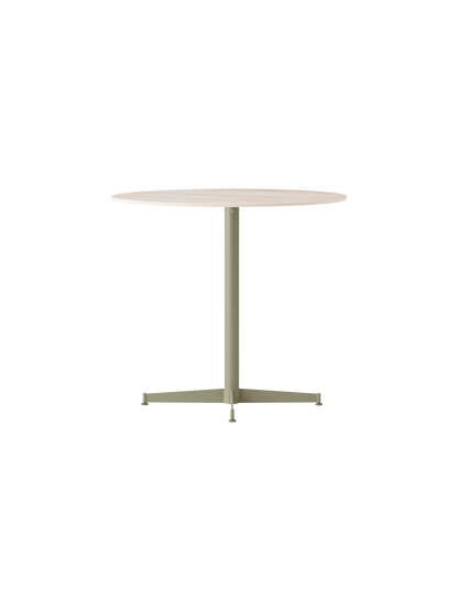 Angle view of the Nook Dining Table, featuring an olive powder-coated steel four-star base and a light round tabletop.