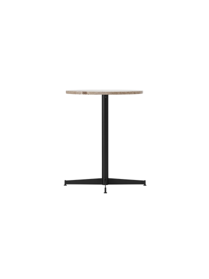 Angled view of the Nook Dining Table with a round Kunis Breccia stone top and a slender black metal four-star base.