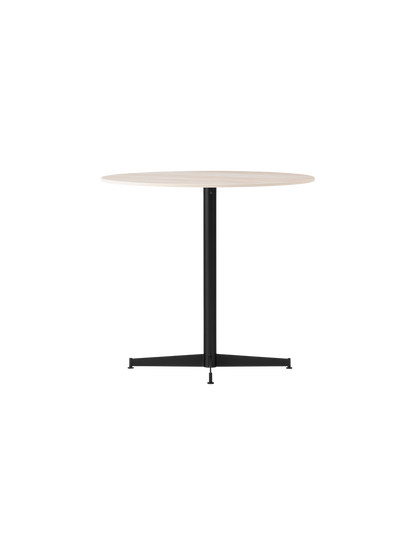Angle view of the Nook Dining Table, featuring a round, light-coloured tabletop and a slim, black four-star pedestal base.